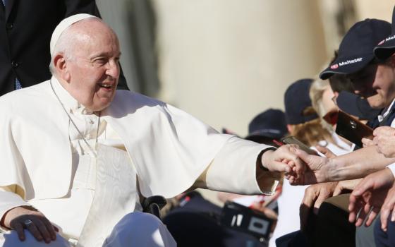 Pope Francis greets people during his general audience in St. Peter's Square at the Vatican Oct. 5, 2022. Vatican News March 10, 2023, published excerpts of a new interview with RSI, a Swiss radio-television broadcasting in Italian, marking his 10 years as pope. (CNS photo/Paul Haring)