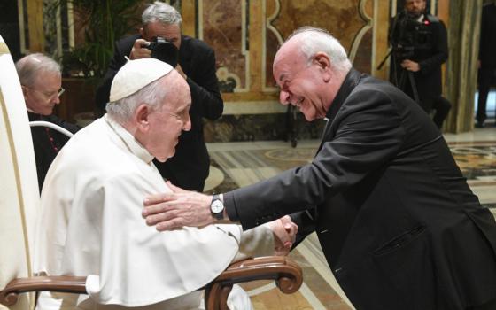 Archbishop Vincenzo Paglia, chancellor of the Pontifical John Paul II Theological Institute for the Sciences of Marriage and Family, greets Pope Francis Oct. 24, 2022, during an audience with staff and students of the institute in the Vatican's Clementine Hall. (CNS photo/Vatican Media)