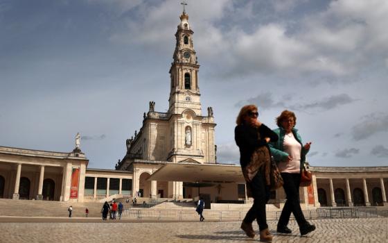 Women walk at the Marian shrine of Fatima in central Portugal March 30, ahead of Holy Week celebrations. (OSV News/Reuters/Pedro Nunes)