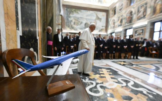 Pope Francis arrives in the Clementine Hall of the Apostolic Palace at the Vatican April 14, 2023, for an audience with executives and staff of ITA Airways, the Italian government-owned airline that flies the pope on his trips abroad. (CNS photo/Vatican Media)