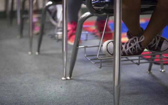 Students sit in a classroom in this 2018 file photo. The director of music ministry at St. Pius X Church in Portland was arrested in an undercover sting for the felony crimes of luring a minor and online sexual corruption of a child in the first degree. (CNS photo/Tyler Orsburn)