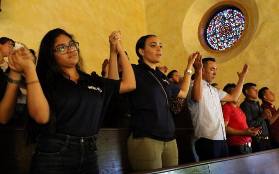 Latino Catholics recite the Lord's Prayer during Mass at the Labor Day Encuentro gathering at Immaculate Conception Seminary in Huntington, N.Y., Sept. 3, 2018. (CNS photo/ Gregory A. Shemitz, Long Island Catholic)