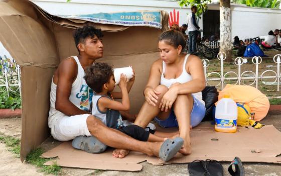 A migrant family in Huehuetán, Mexico, rests at a park with other caravan migrants heading to the U.S. border Nov. 18, 2021. (CNS/Reuters/Jose Torres)