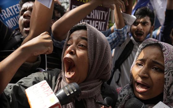 Muslim students shout anti-government slogans during a protest outside Uttar Pradesh house, in New Delhi, June 13, 2022. The students were protesting against persecution of Muslims and recent demolition of their houses after protests against former Bharatiya Janata Party spokesperson Nupur Sharma’s remark deemed derogatory to Islam’s Prophet Muhammad. (RNS/AP/Manish Swarup)