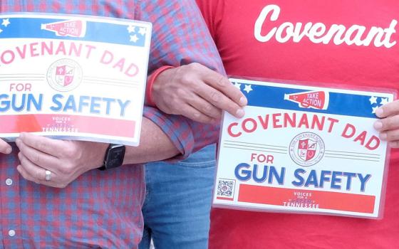 Participants hold signs calling for an end to gun violence outside the Tennessee Capitol in Nashville April 18, during a Voices for a Safer Tennessee event. The group organized a three-mile-long human chain that drew more than 8,000 people and ended at the capitol to urge the Legislature to take steps to address gun violence. (OSV News/Tennessee Register/Andy Telli)