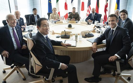 G7 world leaders attend a working session on the final day of the G7 Summit, May 21 in Hiroshima, Japan. From left: Japan's Prime Minister Fumio Kishida, U.S. President Joe Biden, German Chancellor Olaf Scholz, Britain's Prime Minister Rishi Sunak, European Commission President Ursula von der Leyen, Ukrainian President Volodymyr Zelenskyy, European Council President Charles Michel, Gianluigi Benedetti, Italian ambassador to Japan, Canada's Prime Minister Justin Trudeau, and French President Emmanuel Macron.