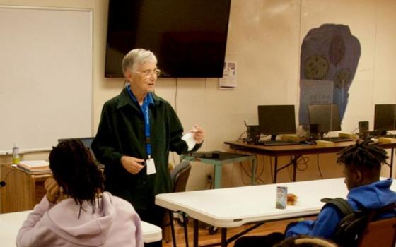 Sr. Kathleen Navarra speaks to students in an after-school program at the Edmundite Missions on March 15 in Selma, Alabama. The missions offer numerous educational programs; only 13% of Selma public high school students tested at or above state proficiency reading levels. (GSR photo/Dan Stockman)