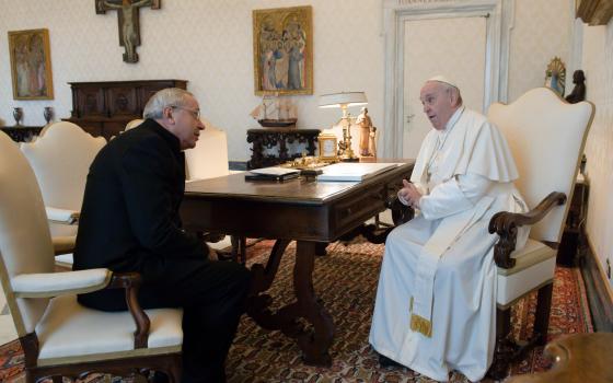 Pope Francis greets Jesuit Father Marko Rupnik during a private audience at the Vatican in this Jan. 3, 2022, file photo. Father Rupnik, whose mosaics decorate chapels in the Vatican, all over Europe, in the United States and Australia, is under restricted ministry after being accused of abusing adult nuns in Slovenia. (CNS photo/Vatican Media)