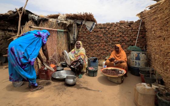 Sudanese refugees who have fled the violence in their country sit in their shelter May 11, 2023, in Koufroun, Chad, near that country's border with Sudan. 