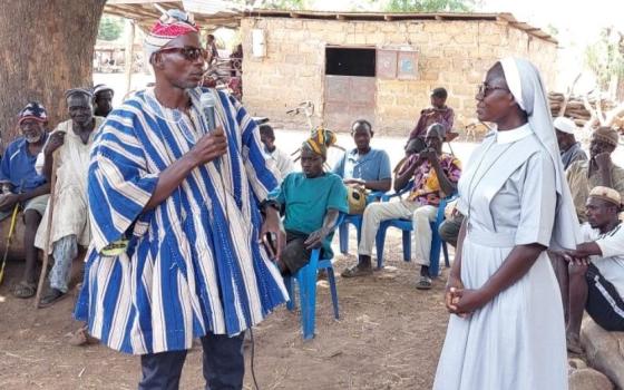 A sister participates in a community engagement session run by the Africa Faith and Justice/Ghana Network. The program aims to educate people about the harms of early or child marriage and find ways to end this longstanding tradition. (Courtesy of Eucharia Madueke)