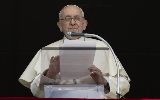 Pope Francis speaks to visitors gathered in St. Peter's Square at the Vatican before praying the Angelus July 2. (CNS/Vatican Media)