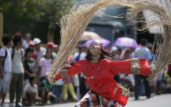 A performer representing a babaylan shaman is pictured at a traditional festival in Bago, in Negros Occidental, Philippines. As Donny Mioskowski Cámara writes about precolonial Philippines, "Masculine and feminine energies coexisted in the babaylan —  women and men — and these leaders were honored for their connection to the divine." (Wikimedia Commons/Hptina24, CC BY-SA 4.0)