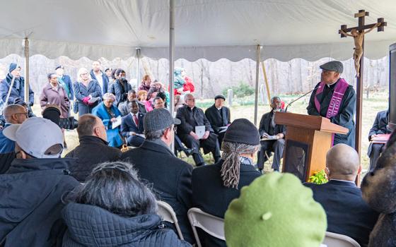 Washington Cardinal Wilton Gregory leads a prayer service Feb. 25 for enslaved people believed to be buried in unmarked graves at the cemetery at Sacred Heart Parish in Bowie, Maryland. The property is on a former plantation once owned by members of the Society of Jesus in the 1700s and 1800s. (OSV News/Catholic Standard/Mihoko Owada)