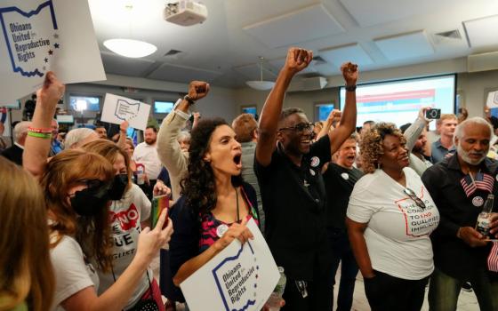 People celebrate the defeat of Issue 1, a Republican-backed measure that would have made it harder to amend the state constitution, an initiative aimed at helping defeat a November referendum that would protect abortion access in the state, after early results were announced during an election night party at the Columbus Fire Fighters Local 67 in Columbus, Ohio, U.S. August 8, 2023. (OSV News photo/Adam Cairns, USA Today Network via Reuters)