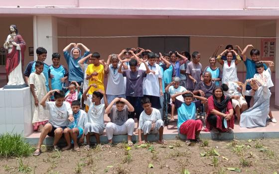 Members of Kkottongnae Sisters of Jesus in Bangladesh, their staff members and orphans are pictured at Kuchilabari in Gazipur, near Dhaka. (Sumon Corraya)