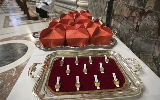 Red birettas and rings are pictured at a consistory led by Pope Francis for the creation of 13 new cardinals in St. Peter's Basilica at the Vatican in this Nov. 28, 2020, file photo. (OSV News/Vatican Media)