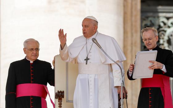 Pope Francis gives his blessing at the end of his weekly general audience in St. Peter’s Square at the Vatican Sept. 27. (CNS/Lola Gomez)