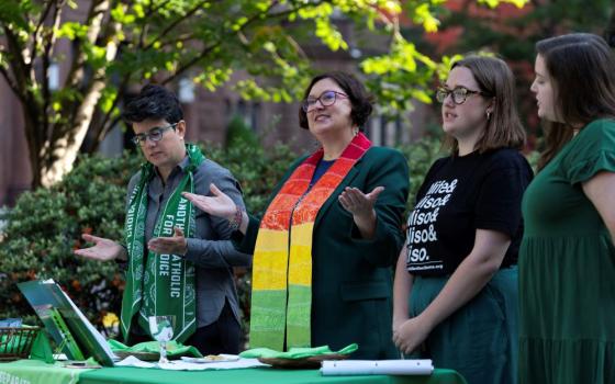 Angela Meyer, a Catholic woman priest (second from left), leads a Green Mass as Catholics for Choice protests the Supreme Court Red Mass outside St. Matthew's Cathedral in Washington, D.C., on Oct. 1. Jamie Manson, president of Catholics for Choice, is at left. (AP Photo/Jose Luis Magana)