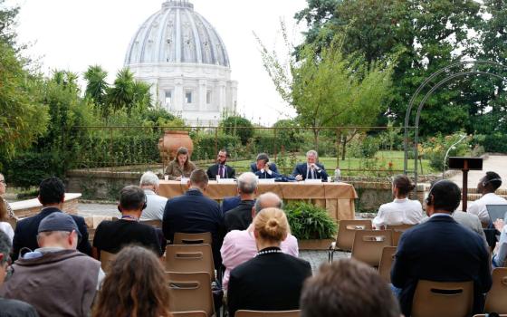 From left, Luisa-Marie Neubauer, a German climate activist; Jonathan Safran Foer, writer; Giorgio Parisi, winner of the 2021 Nobel Prize in Physics; and Matteo Bruni, director of the Vatican press office, speak at a conference about Pope Francis' document on the climate crisis "Laudate Deum" ("Praise God") in the Vatican Gardens Oct. 5, 2023. (CNS/Lola Gomez)