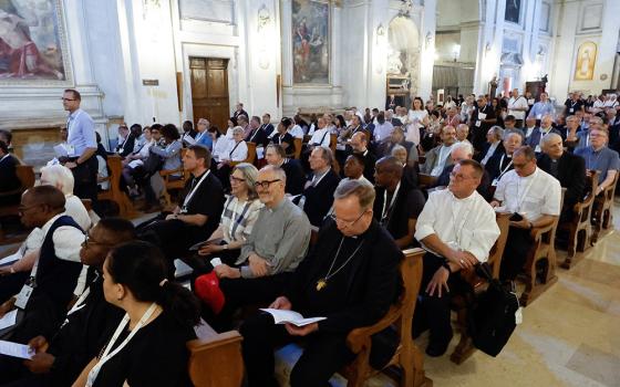 Participants in the assembly of the Synod of Bishops arrive to pray in Rome's Basilica of St. Sebastian as part of their pilgrimage to Rome's ancient catacombs Oct. 12. (CNS/Lola Gomez)