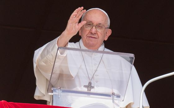 Pope Francis greets visitors gathered in St. Peter's Square at the Vatican to pray the Angelus Oct. 15. (CNS/Vatican Media)