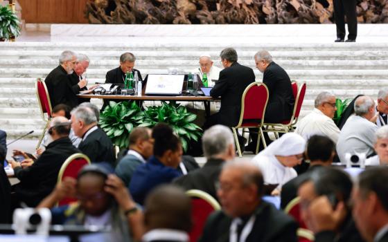 Pope Francis joins leaders and members of the assembly of the Synod of Bishops for a working session in the Vatican's Paul VI Audience Hall Oct. 23, 2023. (CNS photo/Lola Gomez)