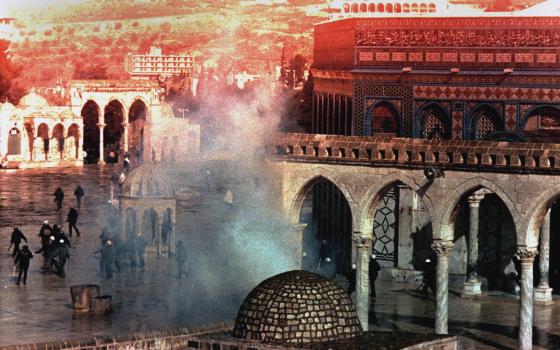 A cloud of tear gas rises from the square in front of the Dome of the Rock mosque during clashes between Palestinians and Israeli troops, which started after the Friday noon prayers on the Temple Mount in the old city of Jerusalem Jan. 15, 1988. (AP/Anat Givon)