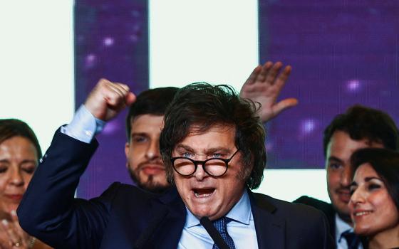 Argentine presidential candidate Javier Milei gestures to supporters as he reacts to the results of the presidential election Oct. 22 in Buenos Aires. Milei claimed 30% of the vote, setting him up for a November runoff with Economy Minister Sergio Massa, who won 36.7% of the vote. (OSV News/Reuters/Matias Baglietto)