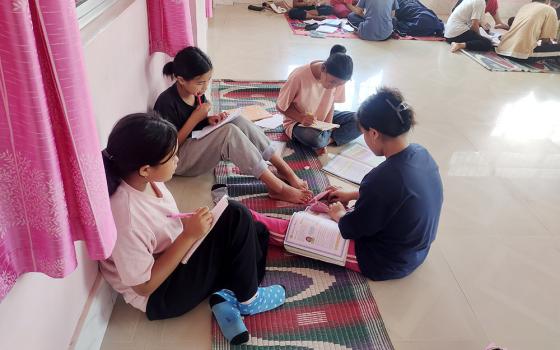 Older girls study with the younger ones at Snehabhavan ("Home of Love"), a girl's orphanage managed by Salesian nuns in Imphal, capital of the troubled Manipur state in northeastern India, after ethnic violence led to the closure of their school. (Thomas Scaria)