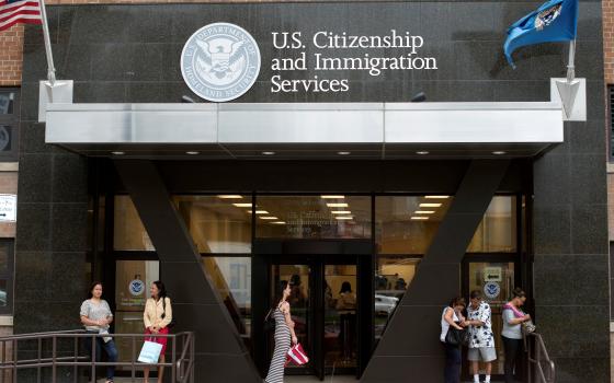 People are pictured in a file photo standing on the steps of the U.S. Citizenship and Immigration Services office in New York City. The federal government has made a procedural change in how it processes green cards for foreign-born religious workers, meaning some foreign-born priests and religious sisters and brothers relied upon by U.S. dioceses may not be able to remain in the country. (OSV News photo/Keith Bedford, Reuters)