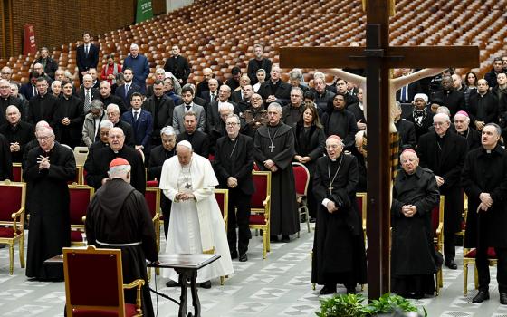 Cardinal Raniero Cantalamessa, preacher of the papal household, presents an Advent meditation for Pope Francis, officials of the Roman Curia and Vatican employees in the Paul VI hall at the Vatican Dec. 15. (CNS/Vatican Media)