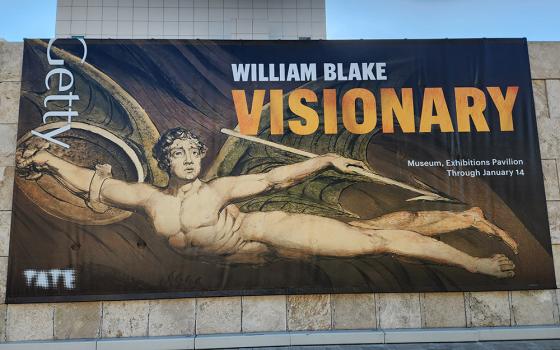 An outdoor banner for the exhibit "WIlliam Blake: Visionary," at the G. Paul Getty Museum in Los Angeles, features a detail of the 1795 print "Satan Exulting over Eve." The exhibit is on display through Jan. 14, 2024. (NCR photo/Chris Herlinger)