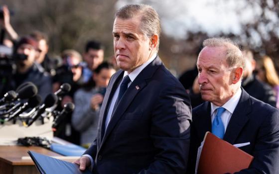 Attorney and businessman Hunter Biden, left, and lawyer Abbe Lowell are surrounded by reporters asking about Biden's potential testimony before the House of Representatives about his foreign business dealings. (Wikimedia Commons/CQ Roll Call/Tom Williams)