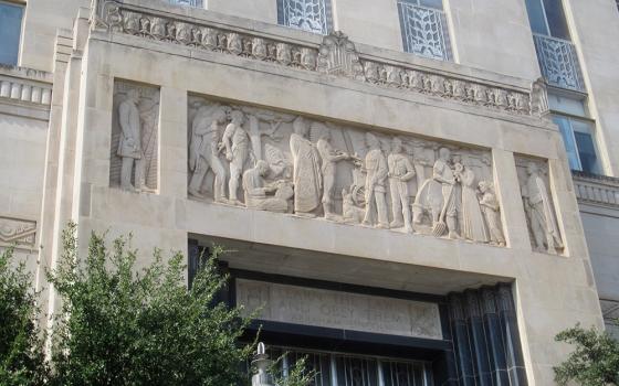 A carved mural above the main entrance of the Oklahoma County Courthouse in Oklahoma City depicts the state's history. A group called the Oklahoma Parent Legislative Action Committee has filed a lawsuit in Oklahoma County District Court, challenging the constitutionality of the planned taxpayer-funded St. Isidore Virtual Catholic Charter School. (Wikimedia Commons/Another Believer)