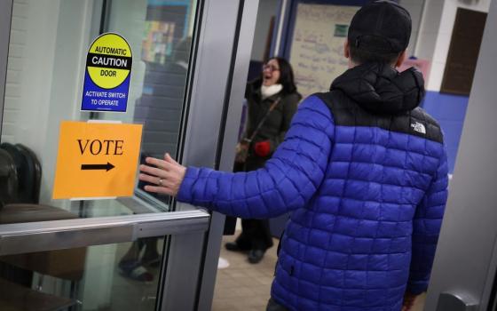 Voters arrive to cast ballots at the Webster School in Manchester, New Hampshire, shortly after polls opened in the New Hampshire presidential primary election Jan. 23. (OSV News/Reuters/Mike Segar)