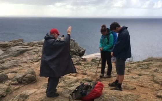 Fr. Peter Daly blesses a young couple on the Camino in Spain in 2016. 