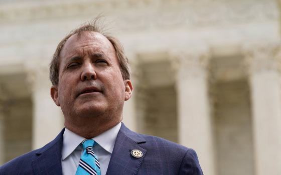 Texas Attorney General Ken Paxton speaks during a news conference in Washington April 26, 2022, after the U.S. Supreme Court heard oral arguments in President Joe Biden's bid to rescind a Trump-era immigration policy that forced migrants to stay in Mexico to await U.S. hearings on their asylum claims. (CNS/Reuters/Elizabeth Frantz)