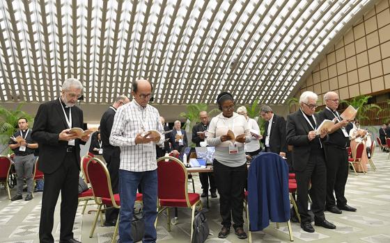 Members of the assembly of the Synod of Bishops gather for morning prayer Oct. 27, 2023, in the Paul VI Audience Hall at the Vatican. (CNS/Vatican Media)