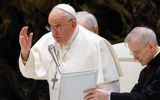 Pope Francis gives his blessing at the end of his weekly general audience in the Paul VI Audience Hall at the Vatican Feb. 7, 2024. (CNS photo/Lola Gomez)