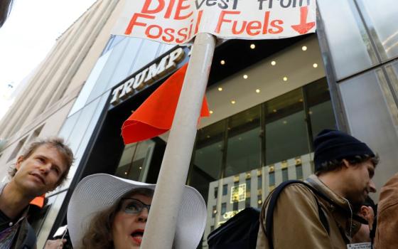 Protesters gather for a fossil fuel and climate change protest outside Trump Tower in New York City on May 9, 2017. 