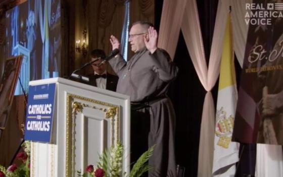 At the March 19 "Catholic Prayer for Trump" at Mar-a-Lago, a man identified as "Father Dennis" prayed for attendees and the Trump family, and blessed the meal.