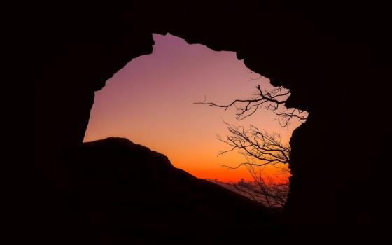 sky seen through cave opening