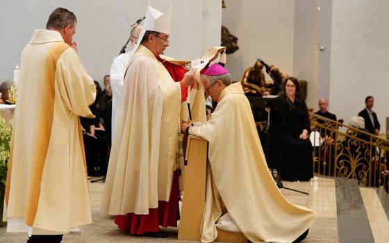 Cardinal Christophe Pierre, nuncio to the United States, vests Las Vegas Archbishop George Leo Thomas with the Pallium during a Mass for elevating the Diocese of Las Vegas to an archdiocese at the Shrine of the Most Holy Redeemer Oct. 16, 2023, in Las Vegas. (OSV News/ Archdiocese of Las Vegas/Robin Jerstad)