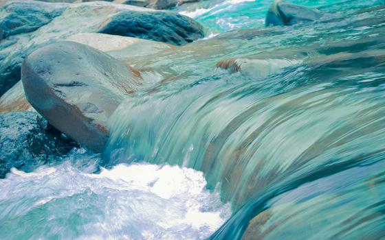 Water flowing over rocks (Unsplash/Leo Rivas)