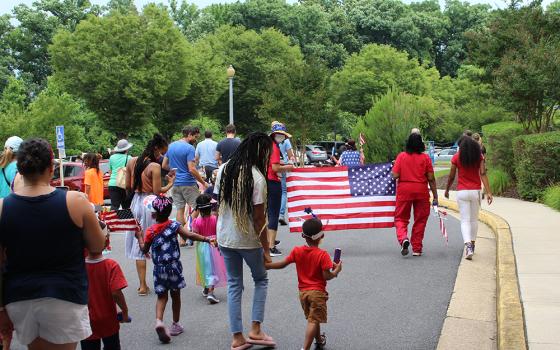 Children with the child care program at St. Ann's Center for Children, Youth and Families participate in a Fourth of July Parade. (Courtesy of St. Ann's Center for Children, Youth and Families)