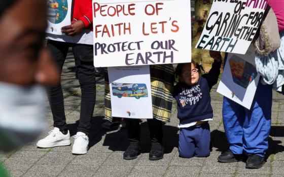 Climate activists demonstrate in South Africa outside the Cape Town International Convention Center Sept. 13, 2023, during the Southern Africa Oil and Gas Conference to call for climate justice resistance against oil and gas corporations and an end to fossil fuels. 