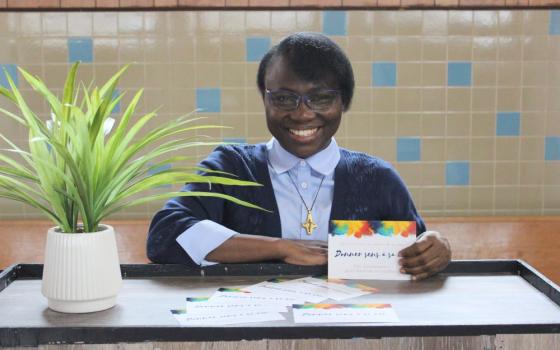 Sr. Joséphine Kimbolo distributes these colorful promotion cards to people she meets. 