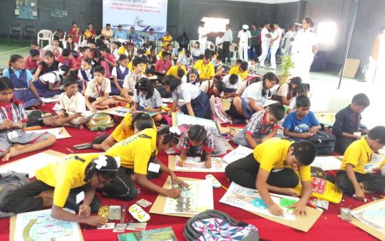 Students of Asha Niketan (House of Hope) Deaf School participate in a painting competition, hosted by the Indian Navy at their headquarters in Karwar, a southwestern Indian coastal town, in September 2023. 