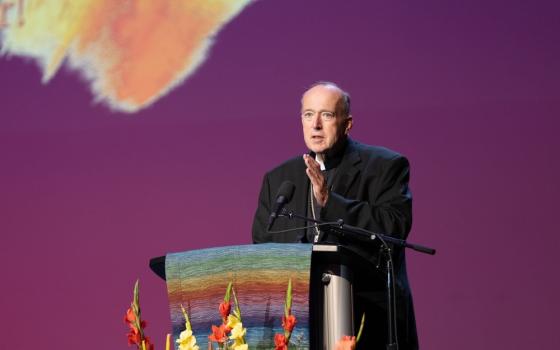 Cardinal McElroy stands at lectern speaking