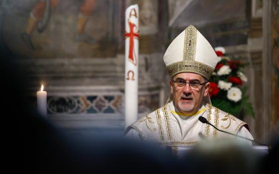 Cardinal Pizzaballa, vested, preaches at lectern